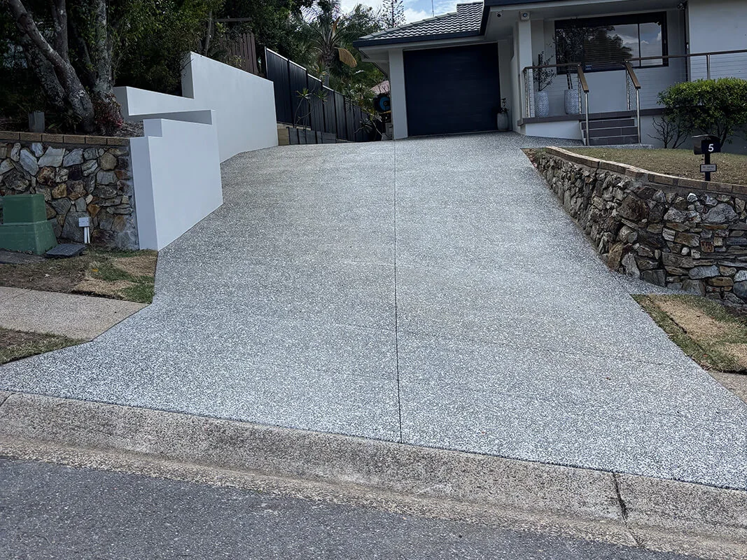 Exposed aggregate concrete driveway in Brisbane by Versatile Concreting